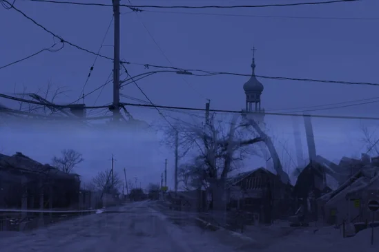 Road at night with power lines and church silhouette.